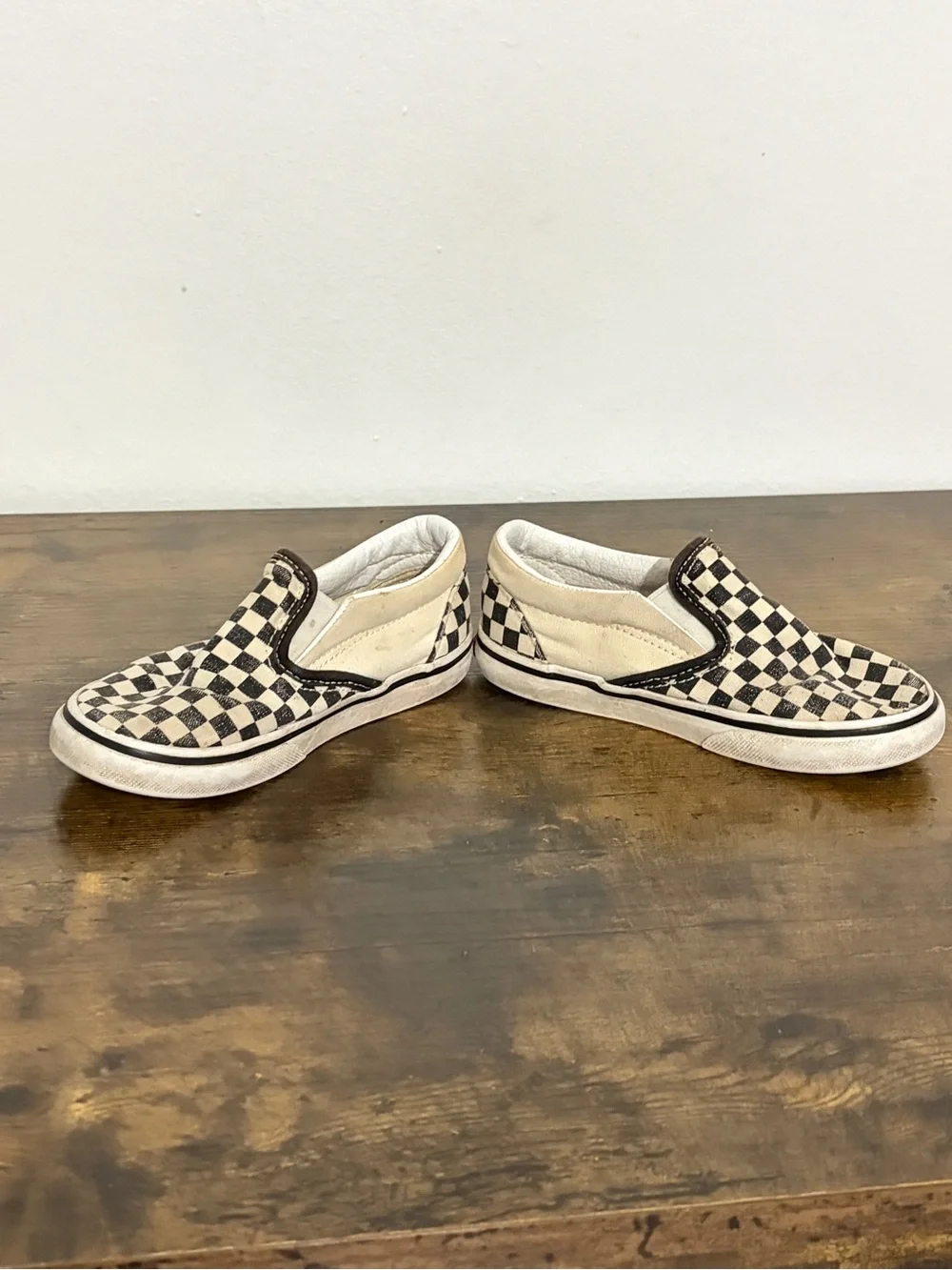 Vans Kids Slip-On Checkerboard Sneakers in Black and Cream